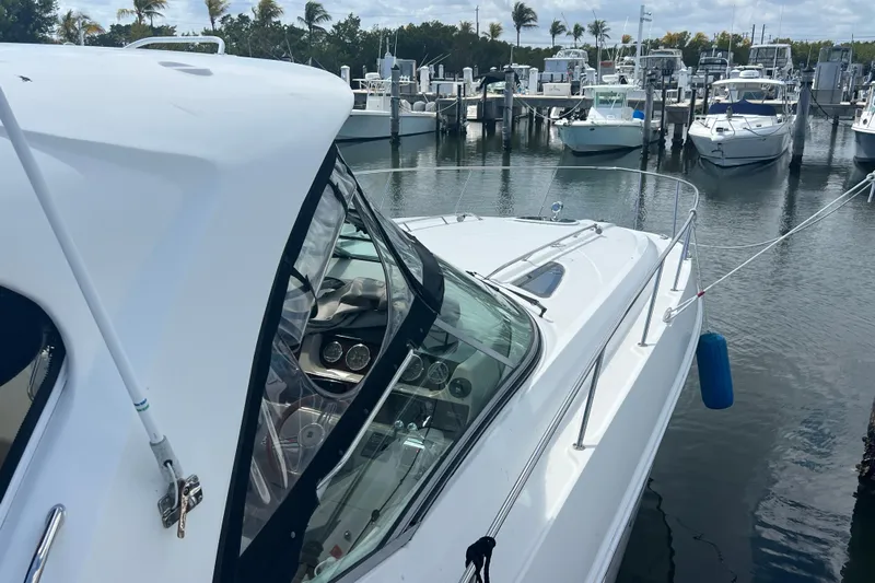 Mango Yacht Photos Pics 2005 Sea Ray Sundancer 350 docked at marina with other boats in background.