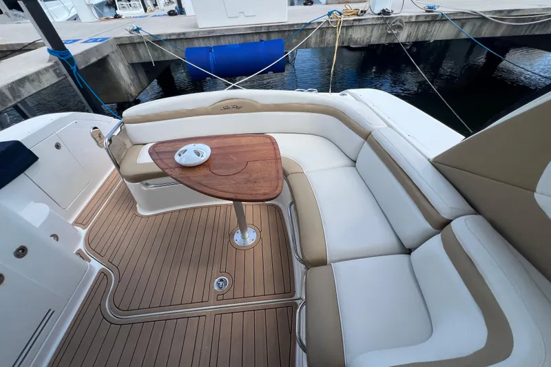 Mango Yacht Photos Pics 2005 Sea Ray Sundancer 350 yacht interior with elegant seating and wooden table.