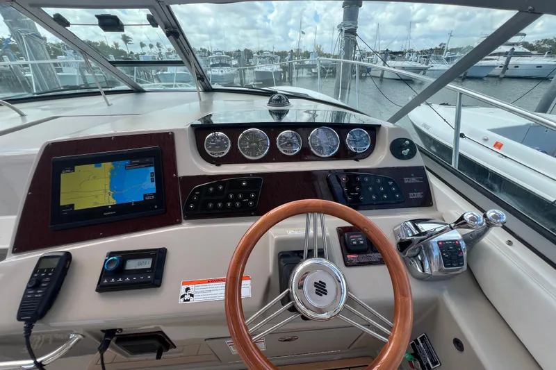 Mango Yacht Photos Pics Helm of 2005 Sea Ray Sundancer 350 with navigation system and controls.