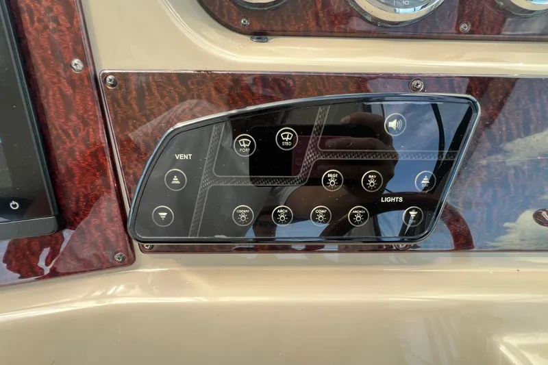 Mango Yacht Photos Pics Control panel of a 2005 Sea Ray Sundancer 350 boat with various switches.