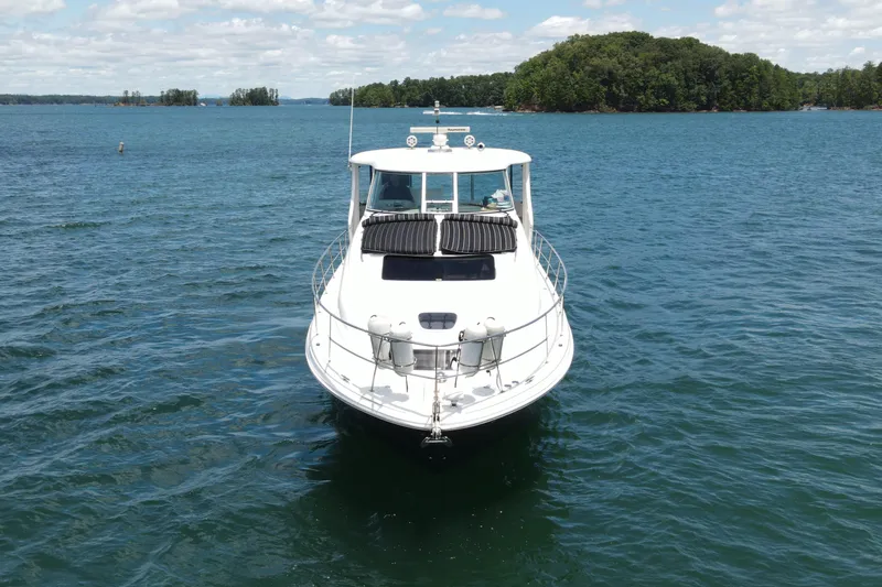  Yacht Photos Pics 2007 Sea Ray 40 Motor Yacht on serene lake with lush green islands.