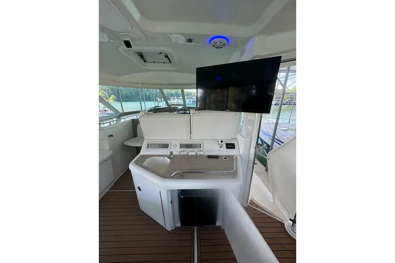  Yacht Photos Pics 2007 Sea Ray 40 Motor Yacht interior with TV, sink, and scenic water view.
