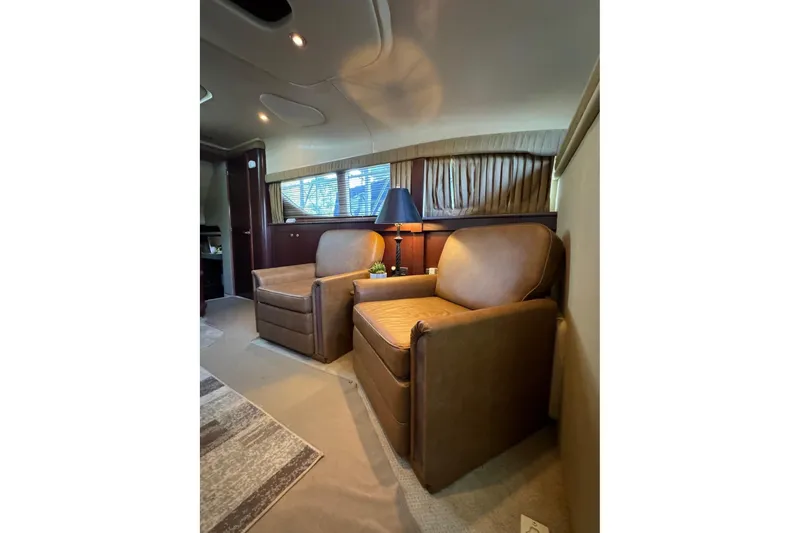  Yacht Photos Pics Luxurious interior of 2007 Sea Ray 40 Motor Yacht with leather chairs and elegant decor.