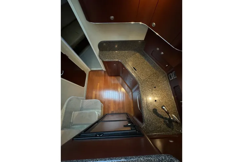  Yacht Photos Pics Interior of 2007 Sea Ray 40 Motor Yacht kitchen with wood flooring and granite countertops.