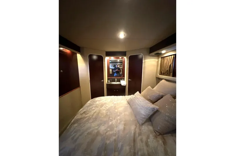  Yacht Photos Pics Luxurious bedroom interior of 2007 Sea Ray 40 Motor Yacht with elegant bedding.