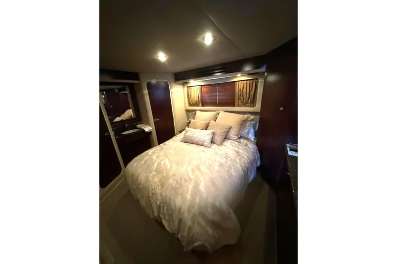  Yacht Photos Pics Luxurious bedroom interior of 2007 Sea Ray 40 Motor Yacht with elegant bedding.