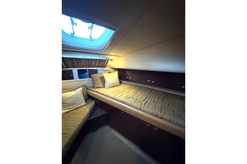  Yacht Photos Pics Interior cabin of 2007 Sea Ray 40 Motor Yacht with cozy bedding and skylight.