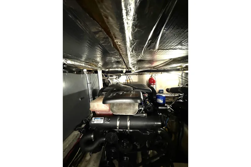  Yacht Photos Pics Engine room of 2007 Sea Ray 40 Motor Yacht, featuring mechanical components and fire extinguisher.