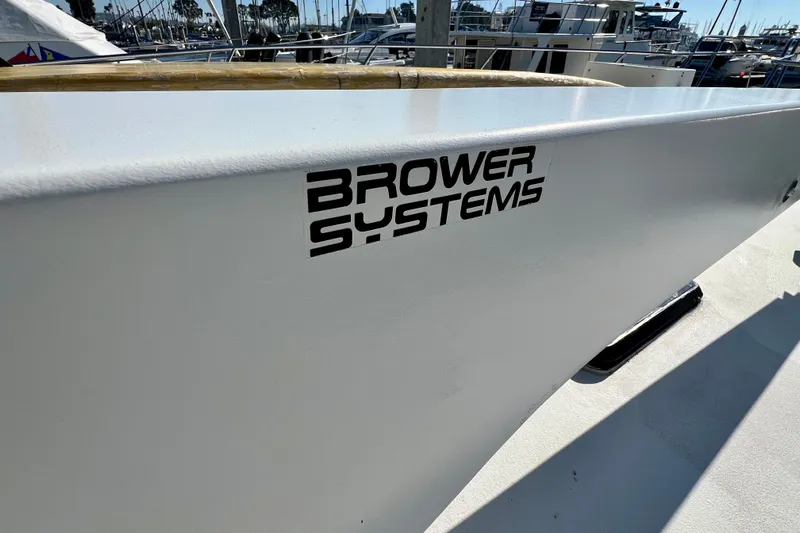 Live Wire Yacht Photos Pics Bertram 46 Convertible 1982 boat with Brower Systems logo on deck.