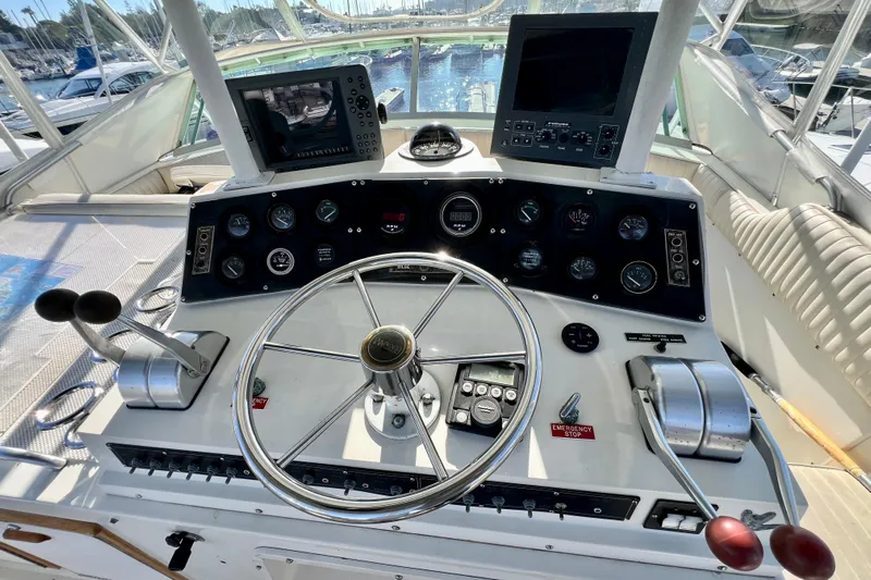 Live Wire Yacht Photos Pics 1982 Bertram 46 Convertible yacht helm with dual controls and navigation screens.