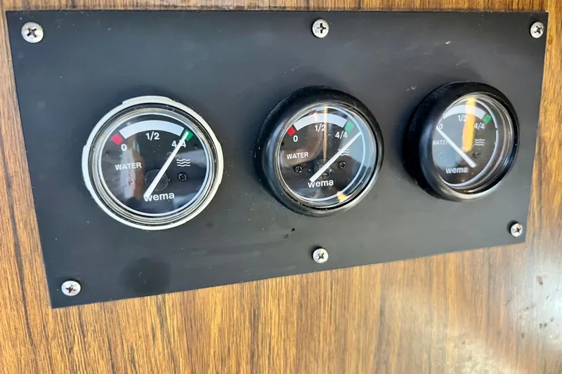 Live Wire Yacht Photos Pics Water level gauges on 1982 Bertram 46 Convertible boat dashboard.