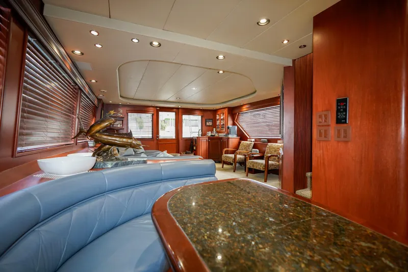Pole Position Yacht Photos Pics Luxurious interior of a 1997 Hatteras Sportfish yacht with elegant wood finishes.