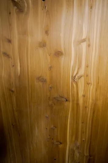 Pole Position Yacht Photos Pics Close-up of wooden paneling on a 1997 Hatteras Sportfish boat.