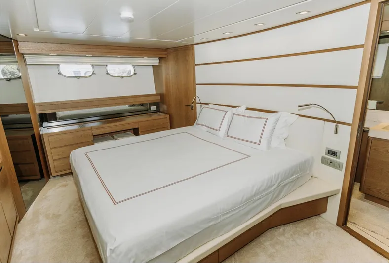  Yacht Photos Pics Luxurious bedroom interior of 2009 Sanlorenzo SL72 yacht with modern design and elegant furnishings.