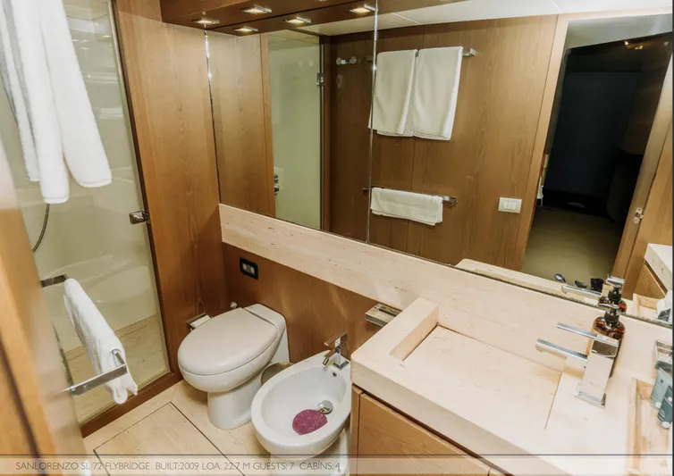 Yacht Photos Pics Luxurious bathroom in 2009 Sanlorenzo SL72 yacht with modern fixtures and wooden accents.