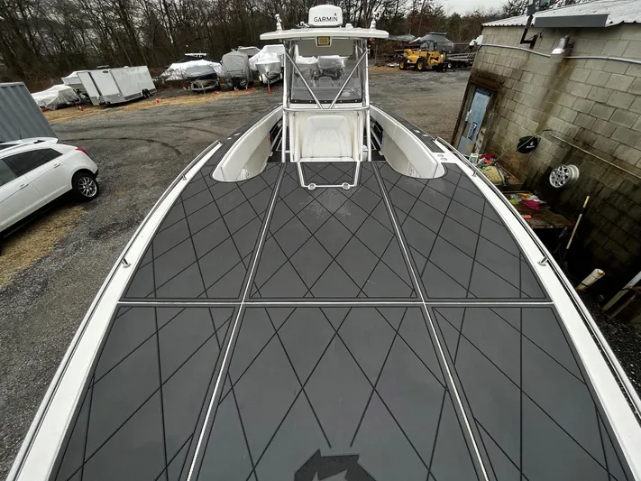 Steelin Time III Yacht Photos Pics 2011 Fountain 38 CC Tournament Edition boat with sleek deck design in a storage yard.
