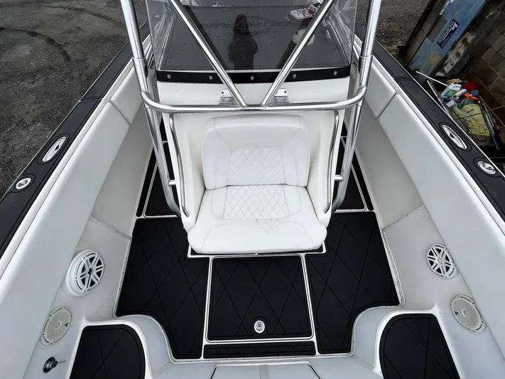 Steelin Time III Yacht Photos Pics 2011 Fountain 38 CC Tournament Edition boat interior with white seating and black flooring.