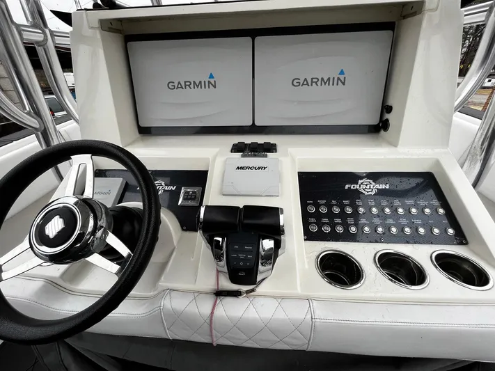 Steelin Time III Yacht Photos Pics 2011 Fountain 38 CC Tournament Edition boat dashboard with Garmin displays and Mercury controls.