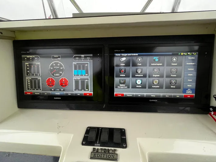 Steelin Time III Yacht Photos Pics Dual Garmin displays on 2011 Fountain 38 CC Tournament Edition boat dashboard.