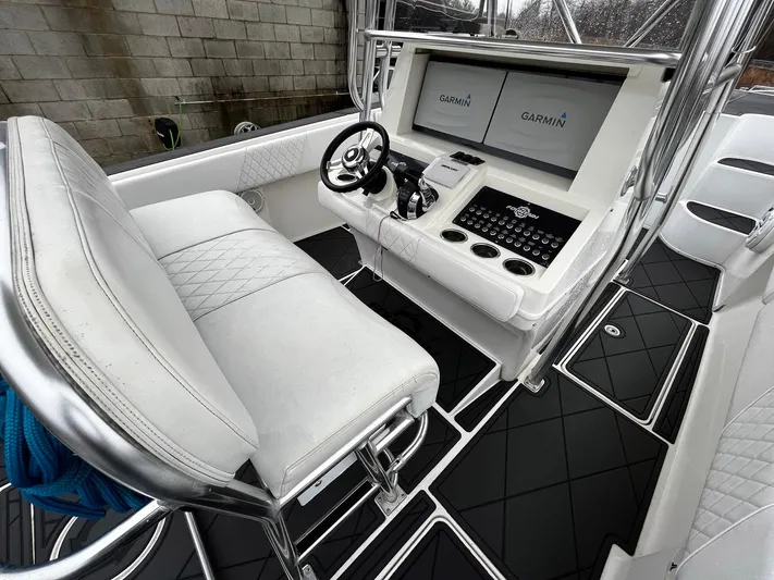 Steelin Time III Yacht Photos Pics 2011 Fountain 38 CC Tournament Edition boat cockpit with Garmin navigation displays and white seating.