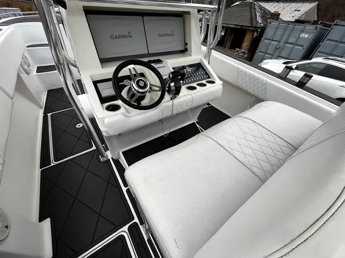 Steelin Time III Yacht Photos Pics 2011 Fountain 38 CC Tournament Edition boat cockpit with Garmin displays and white seating.
