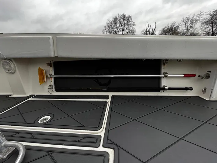 Steelin Time III Yacht Photos Pics 2011 Fountain 38 CC Tournament Edition boat deck with storage compartment and cleaning tools.