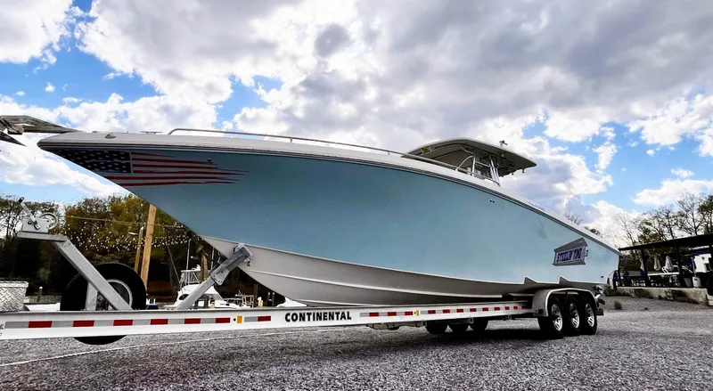 Steelin Time III Yacht Photos Pics 2011 Fountain 38 CC Tournament Edition boat on trailer under cloudy sky.