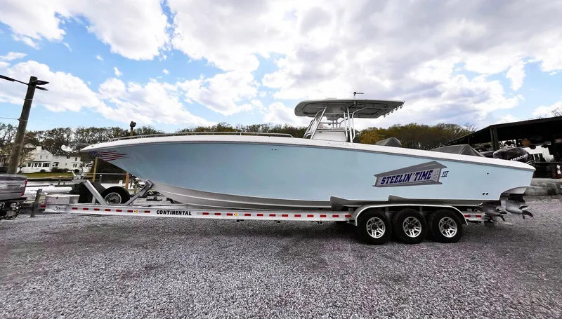 Steelin Time III Yacht Photos Pics 2011 Fountain 38 CC Tournament Edition boat on a trailer under a cloudy sky.