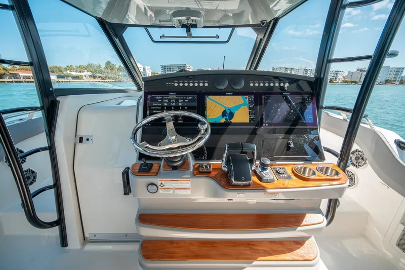 Pipe Dream Yacht Photos Pics 2023 Boston Whaler 420 Outrage helm with advanced navigation and control systems.