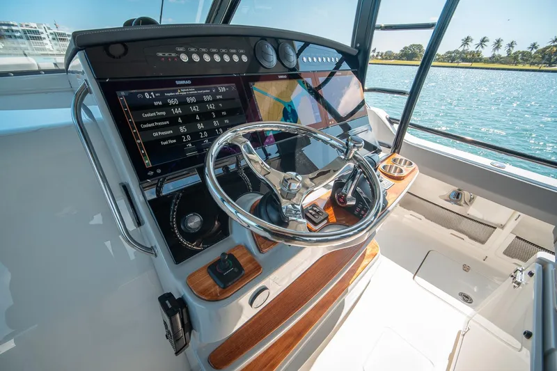 Pipe Dream Yacht Photos Pics 2023 Boston Whaler 420 Outrage helm with advanced navigation and control systems.