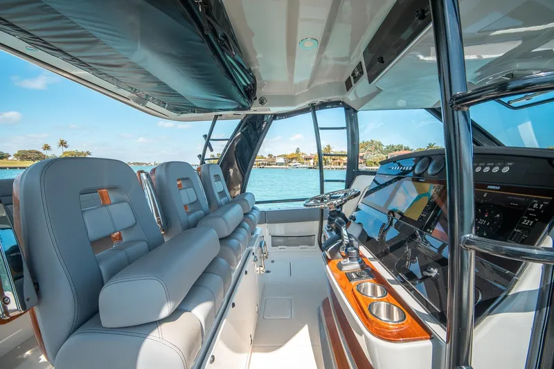 Pipe Dream Yacht Photos Pics Interior of 2023 Boston Whaler 420 Outrage boat with luxurious seating and advanced controls.