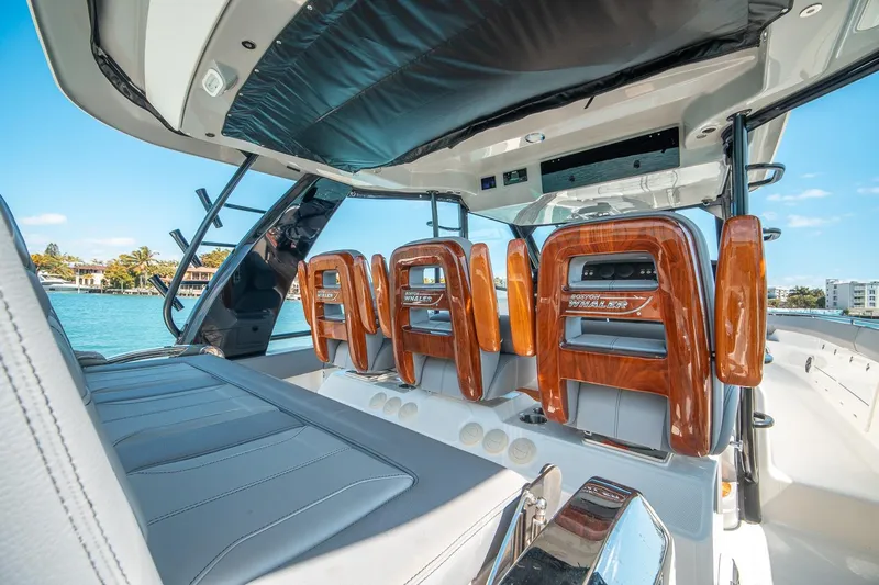 Pipe Dream Yacht Photos Pics 2023 Boston Whaler 420 Outrage interior with luxurious seating and sleek design.