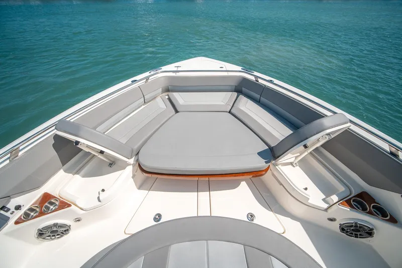 Pipe Dream Yacht Photos Pics 2023 Boston Whaler 420 Outrage boat interior with cushioned seating and ocean view.