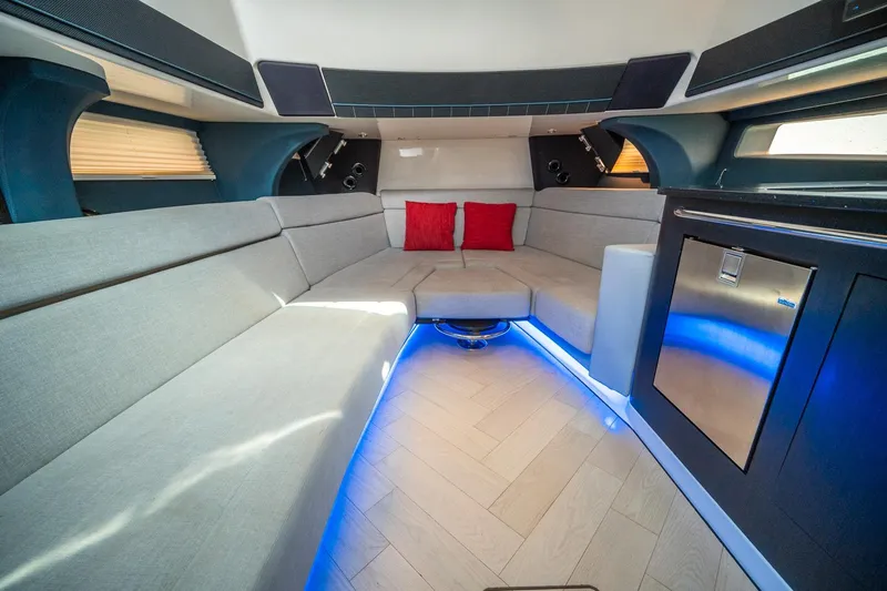 Pipe Dream Yacht Photos Pics Luxurious interior of 2023 Boston Whaler 420 Outrage with modern seating and ambient lighting.