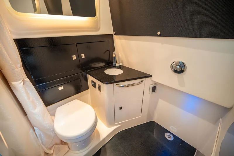 Pipe Dream Yacht Photos Pics Luxurious bathroom interior of 2023 Boston Whaler 420 Outrage boat.