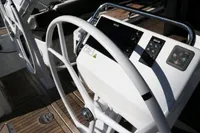 Steering wheel and controls of a 2017 Hanse 455 yacht, featuring modern navigation equipment.