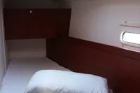 Cozy cabin interior of 2017 Hanse 455 yacht with bed and skylight.