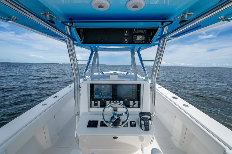  Yacht Photos Pics Center console of a 2015 Bahama 41 boat with ocean view.
