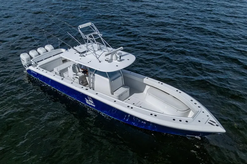  Yacht Photos Pics 2015 Bahama 41 boat on water, featuring sleek design and multiple outboard engines.