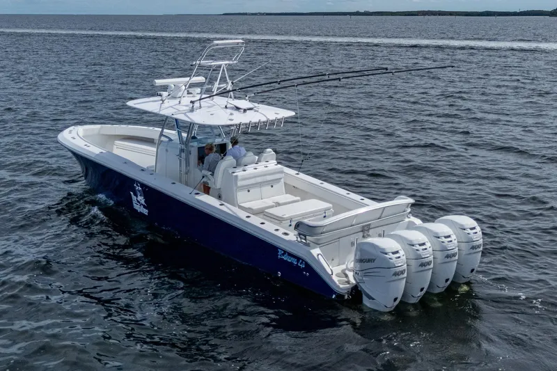  Yacht Photos Pics 2015 Bahama 41 boat with four Mercury engines cruising on open water.