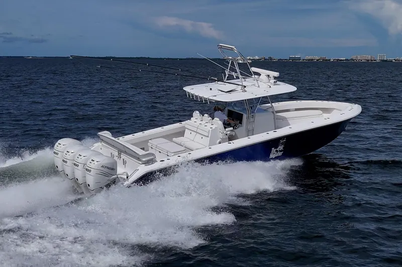  Yacht Photos Pics 2015 Bahama 41 boat cruising on open water with powerful outboard engines.