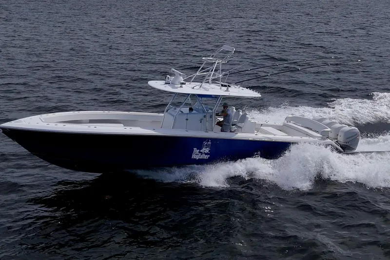  Yacht Photos Pics 2015 Bahama 41 boat cruising on open water with fishing rods.