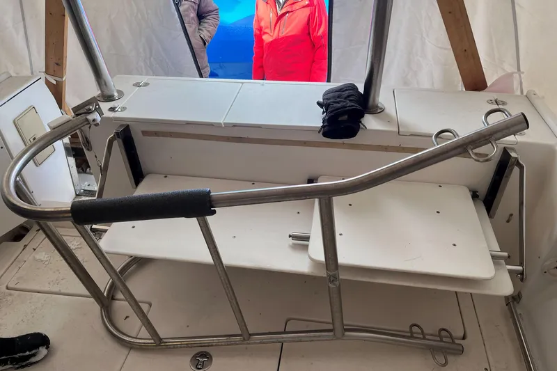  Yacht Photos Pics 2008 Albin 28 Tournament Express boat interior with stainless steel railing and seating area.