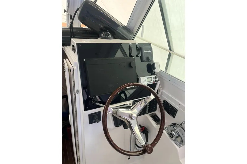  Yacht Photos Pics 2008 Albin 28 Tournament Express helm with steering wheel and navigation equipment.