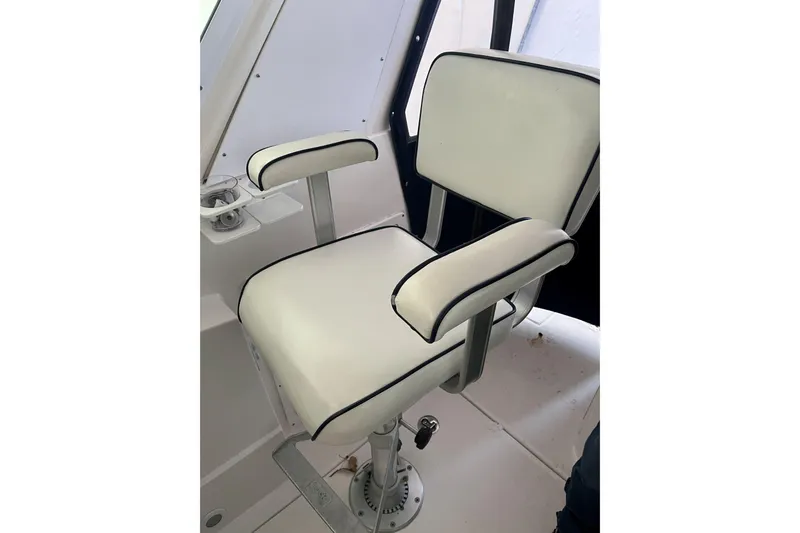  Yacht Photos Pics White captain's chair on 2008 Albin 28 Tournament Express boat, featuring sleek design and comfort.