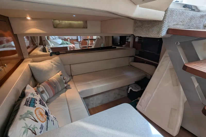 Fansea Yacht Photos Pics Interior of 2009 Sea Ray 350 Sundancer with cozy seating and decorative pillows.