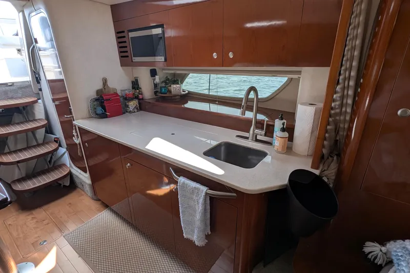 Fansea Yacht Photos Pics Luxurious 2009 Sea Ray 350 Sundancer yacht kitchen interior with modern amenities.
