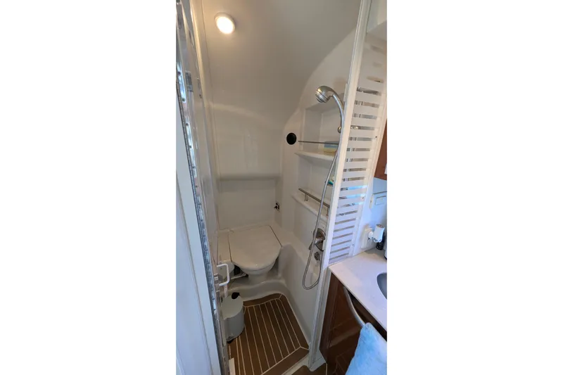 Fansea Yacht Photos Pics Compact bathroom in 2009 Sea Ray 350 Sundancer yacht with shower and toilet.
