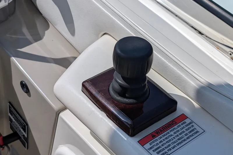 Fansea Yacht Photos Pics Joystick control on 2009 Sea Ray 350 Sundancer boat dashboard with warning label.