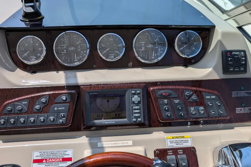 Fansea Yacht Photos Pics Dashboard of a 2009 Sea Ray 350 Sundancer boat with gauges and controls.